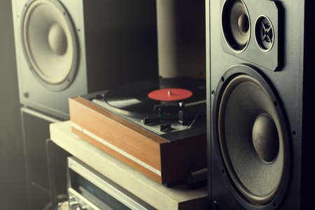 HiFi system with turntable, amplifier, headphones and lp vinyl records in a listening room
