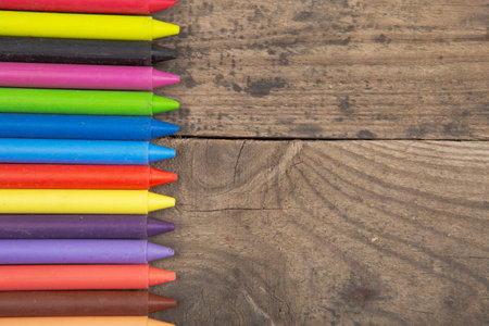 Crayons on the wooden deskの写真素材