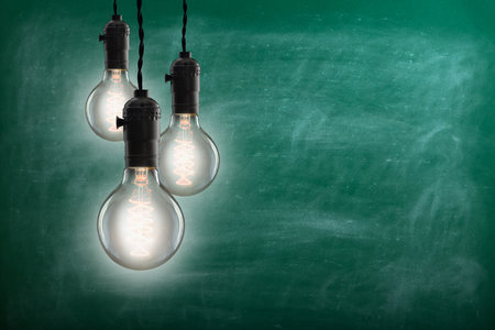 Idea concept - incandescent bulb on black backgroundの写真素材