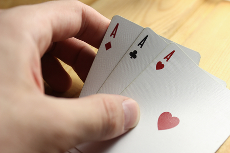 Cards for the poker on the wooden backgroundの写真素材
