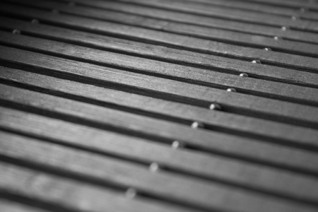 Black, wooden background of bamboo close-up. Abstractionの写真素材