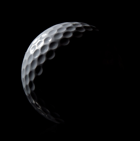 Stylish Golf Ball on a Black Backgroundの写真素材