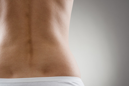 Healthy spine and loin. Close up of part of female back.
