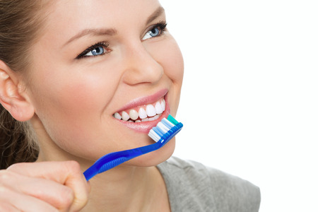 Teeth washing. Disease prevention. Portrait of young Caucasian female model with beautiful white...