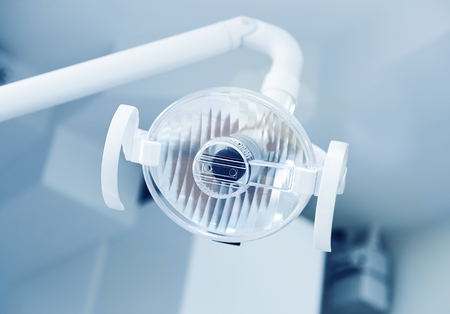 Close-up of the lamp in dental clinic. Interior of dentist office. Health care and medicine.の写真素材