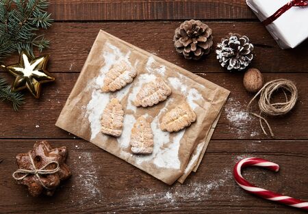 Xmas cookies, stars gingerbread, candy and new year symbols on wooden table. Concept of winter...