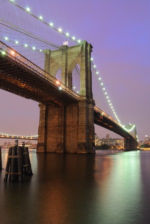 The Brooklyn Bridge shimmering at night.の写真素材