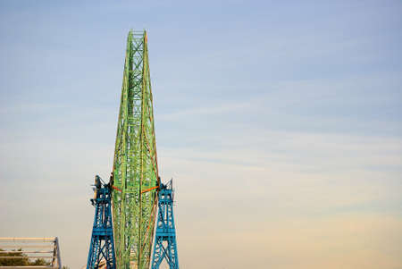 Sideview of a ferris wheel with empty sky for copy space.