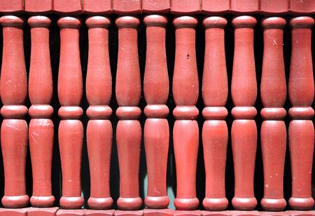 Close up of a red wooden fence