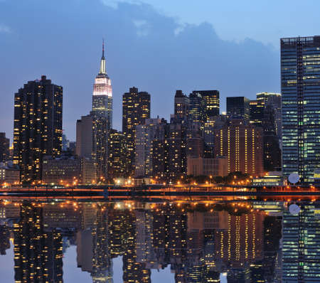 The Lower Manhattan Skyline with serious reflections in New York City.の写真素材