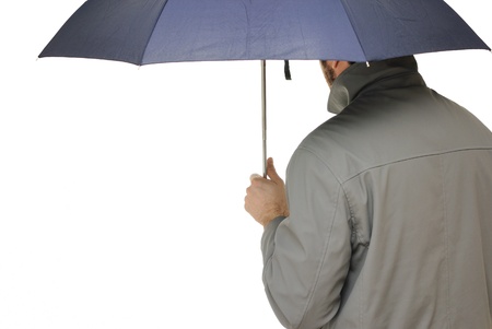 Man with an umbrella and raincoat isolated on white.の写真素材