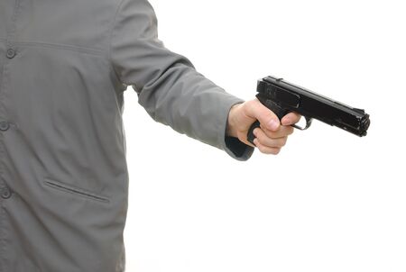 Man pointing a gun isolated on white background.の写真素材
