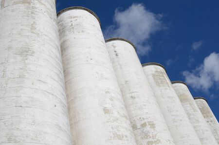 Large industrial silos in a rowの写真素材