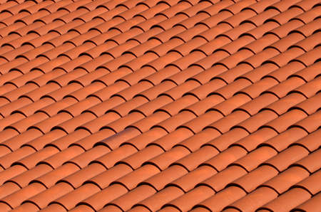 a red tiled terracotta roofの写真素材