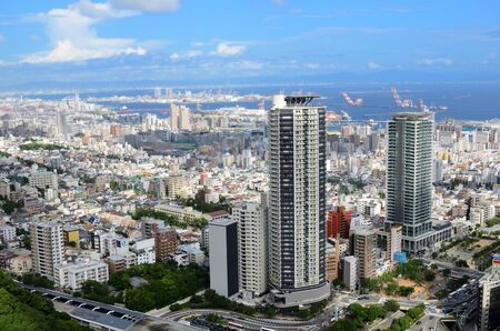 Kobe, Japan - July 8, 2011: Skyline of Kobe, Japan with building logos and corporate names visible.のeditorial素材