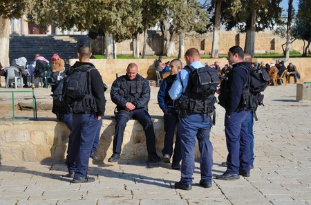 JERUSALEM - FEBRUARY 20: Israeli Border Police chat February 20, 212 in Jerusalem, IL. Known as...