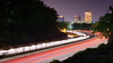 Greenville, South Carolina skyline above the flow of traffic on Interstate 385. Greenville, South Carolina skyline above the flow of traffic on Interstate 385.