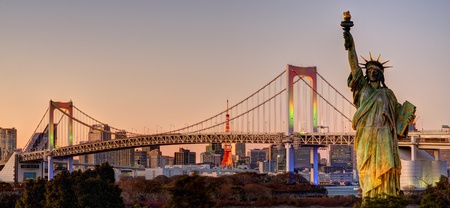 Statue of Liberty, Rainbow Bridge, and Tokyo Tower as seen from Odaiba in Tokyo, Japan.のeditorial素材