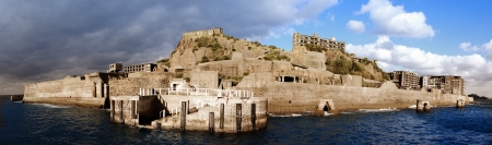 Abandoned island of Gunkanjima in off the coast of Nagsaki, Japan. The island was populated as a coal mining town from 1887 but was abrubtly abandoned in 1974 due to petroleum use.のeditorial素材