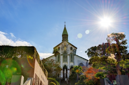 NAGASAKI - DECEMBER 9, 2012: Visitors exit Oura Roman Catholic Church December 9, 2012 in Nagasaki, JP. Built in 1853 after the isolation period, it is said to be the oldest church in the country.のeditorial素材