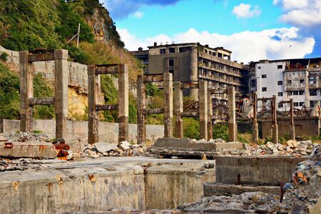 Abandoned island of Gunkanjima off the coast of Nagasaki, Japan. The island was populated as a coal mining town from 1887 but was abruptly abandoned in 1974.の写真素材