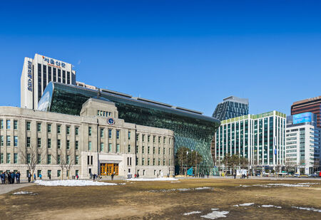 SEOUL - FEBRUARY 19: The City hall of Seoul February 19, 2013 in Seoul, ROK. The historic building sits directly in front of the new city hall building opened 2012.のeditorial素材