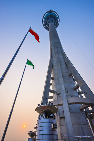 MACAU, CHINA - OCTOBER 12, 2012: Macau Tower exterior at dusk. At 233 meters, the tower offers the second highest commercial bungee jump in the world.のeditorial素材