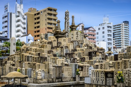 OSAKA, JAPAN - MAY 6, 2014: Graves at Shitennoji Temple in Osaka Japan. The temple is noted as the first officially sanctioned religious establishment in the country dating from AD 593.のeditorial素材