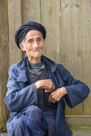 An elderly member of the Yao minority people in Tiantou Village, Guangxi, China.のeditorial素材
