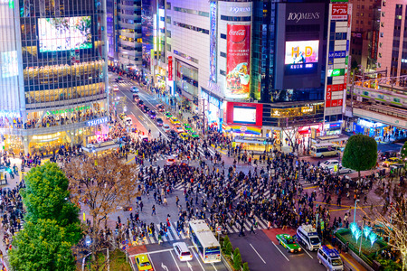 TOKYO, JAPAN - DECEMBER 23, 2012: Pedestrians cross at Shibuya Crossing. It is one of the world's most famous scramble crosswalks.のeditorial素材