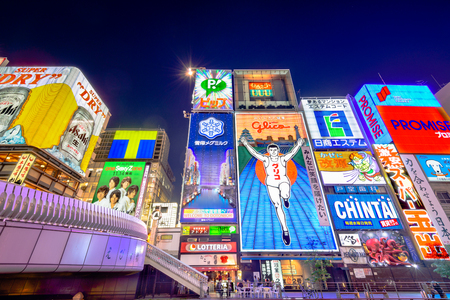 OSAKA - NOVEMBER 25, 2012: The famed advertisements of Dotonbori at night. With a history reaching back to 1612, the district is now one of Osaka's primary tourist destinations.のeditorial素材