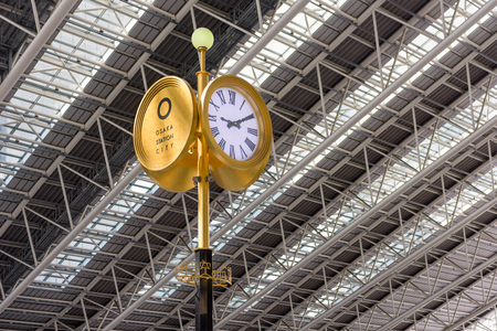 OSAKA, JAPAN - AUGUST 13, 2015: Clock in Osaka City Station's Sora no Hiroba plaza.のeditorial素材