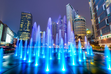 Kuala Lumpur, Malaysia night cityscape and fountain in the financial district.の写真素材