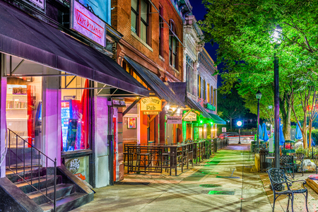 ATHENS, GEORGIA - AUGUST 13, 2017: Shops and bars along College Avenue in downtown Athens at night.のeditorial素材