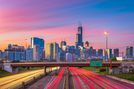 Chicago, Illinois, USA downtown skyline over highways at twilight.の写真素材