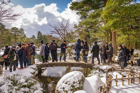 KANAZAWA, JAPAN - JANUARY 14, 2017: Tourists at Kenrokuen Gardens during the winter season.のeditorial素材