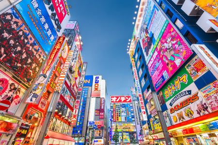 TOKYO, JAPAN - AUGUST 1, 2015: The colorful signs in Akihabara. The historic electronics district has evolved into a shopping area for video games, anime, manga, and computer goods.のeditorial素材