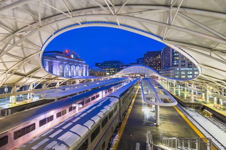DENVER, COLORADO - MARCH 13, 2019: Trains out of service at Union Station after the "Bomb Cyclone" winter weather event. The central portion of the station was completed in 1914.のeditorial素材