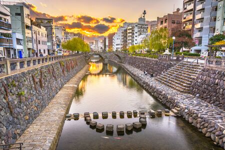 Nagasaki, Japan cityscape with Megane Spectacles Bridge at sunset.の写真素材