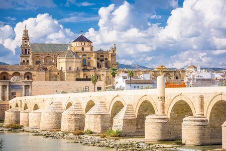 Cordoba, Spain at the Roman Bridge and Mosque-Cathedral on the Guadalquivir River. の写真素材
