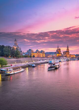 Dresden, Germany cityscape of cathdedrals over the Elbe River at dusk.の写真素材