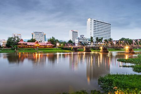 Chiang Mai, Thailand hotel skyline on the Ping River at dusk.の写真素材