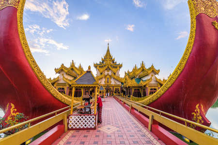 YANGON, MYANMAR - OCTOBER 17, 2015: Entrance to Karaweik Palace in Kandawgyi Royal Lake at dusk.のeditorial素材