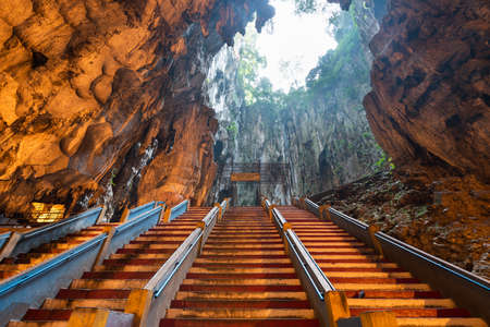 KUALA LUMPUR, MALAYSIA - SEPTEMBER 20, 2015: Worshippers pray inside Batu caves Hindu Shrine.のeditorial素材