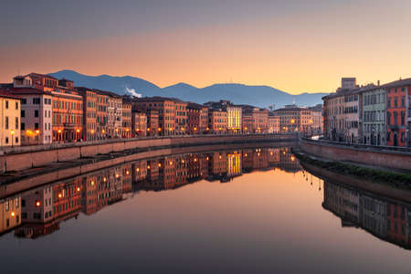 Pisa, Italy skyline on the Arno River at dusk.の写真素材