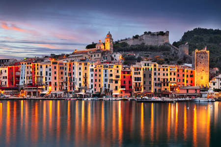 Porto Venere, La Spezia, Italy historic town skyline with Christmas lights at dusk.の写真素材