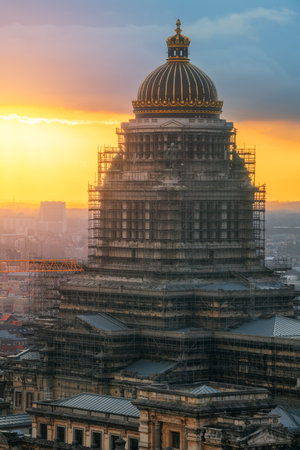 Brussels, Belgium cityscape at the Palais de Justice dome covered in decades old scaffolding at dusk.のeditorial素材