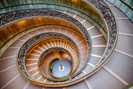 VATICAN - DECEMBER 9, 2021:  Bramante Staircase in the Vatican Museum.