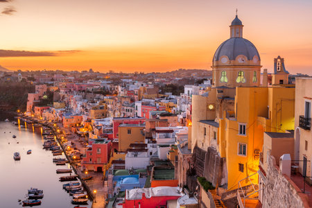 Procida, Italy old town skyline in the Mediterranean Sea during dusk.の写真素材
