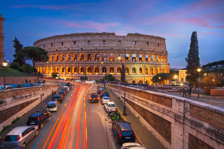 Rome, Italy at the Colosseum over the street at night.の写真素材